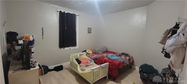 bedroom with light hardwood / wood-style flooring