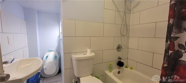 full bathroom with toilet, shower / bath combo, tile walls, and sink