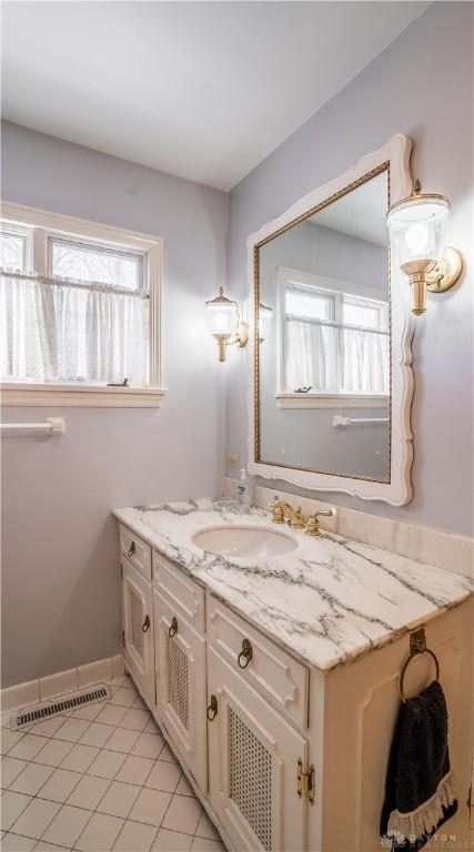 bathroom with vanity and tile patterned flooring