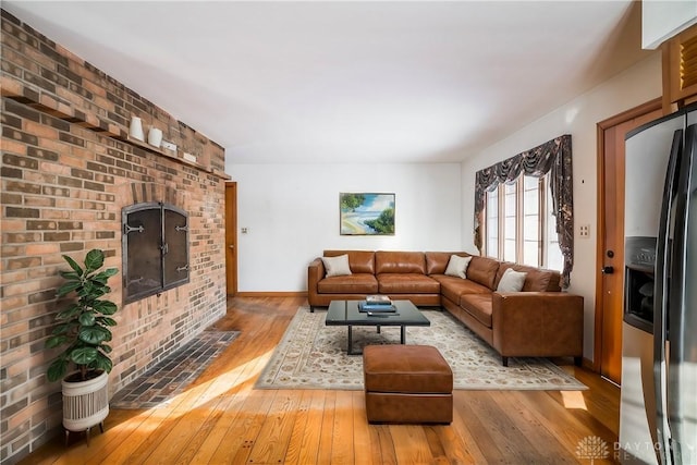 living room featuring hardwood / wood-style floors and a fireplace