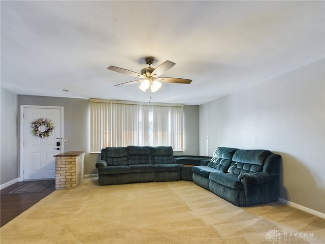 living room featuring ceiling fan and carpet flooring