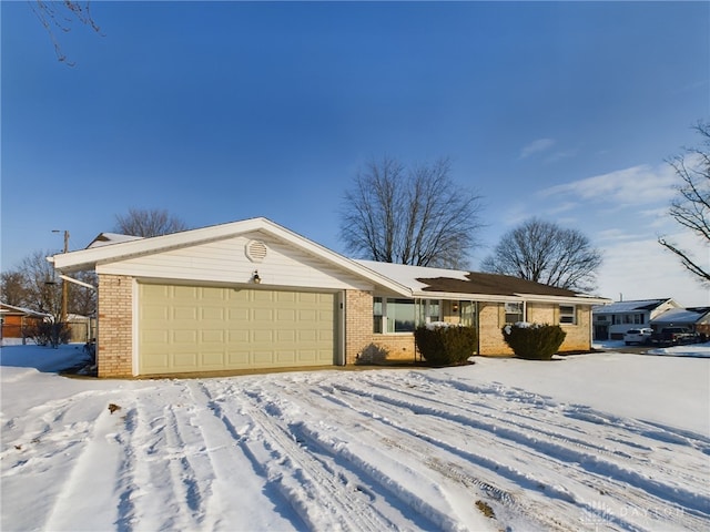 single story home featuring a garage