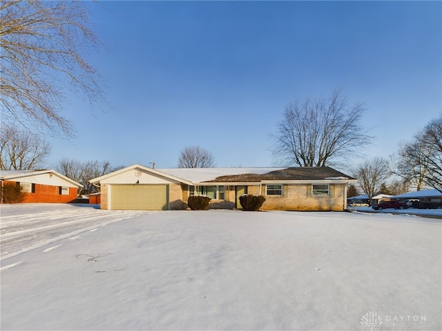 single story home featuring a garage