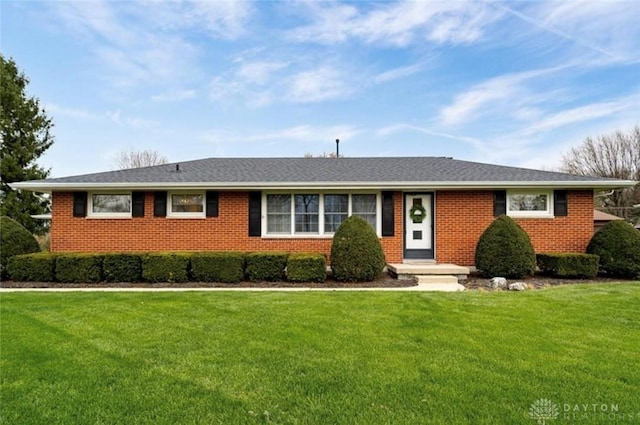 ranch-style house with a front lawn