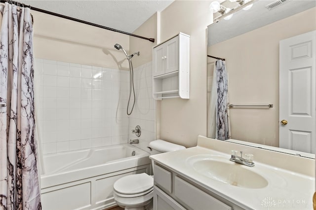 full bathroom featuring a textured ceiling, toilet, vanity, and shower / bath combination with curtain