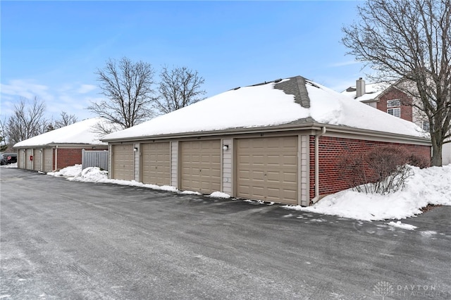 view of snow covered garage