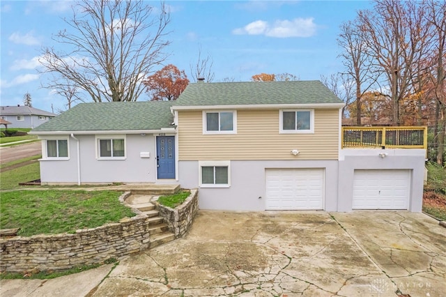 view of front of property with a garage