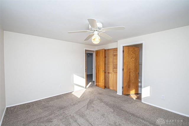 unfurnished bedroom featuring ceiling fan and carpet flooring