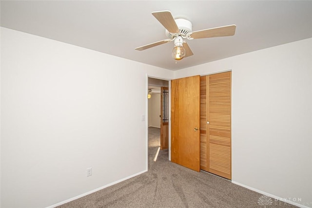 unfurnished bedroom with light carpet, a closet, and ceiling fan