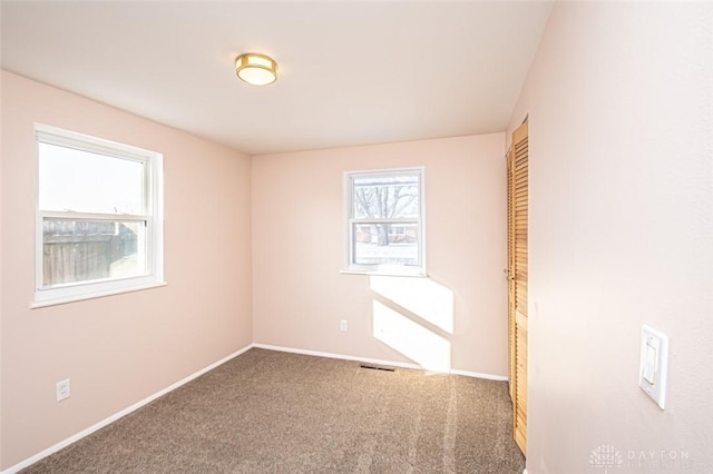 spare room featuring carpet floors