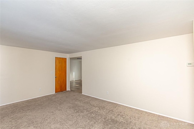 spare room featuring carpet floors