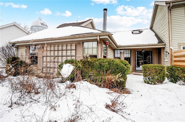 view of snow covered property