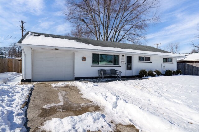 single story home featuring a garage