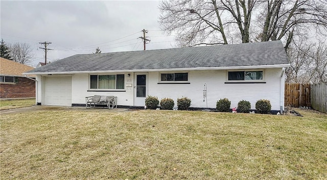 view of front of home with a garage and a front yard