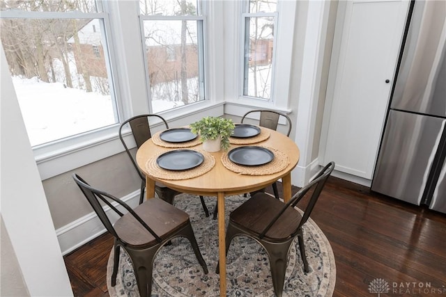 dining room with dark hardwood / wood-style floors