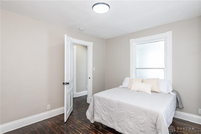 bedroom featuring dark hardwood / wood-style flooring