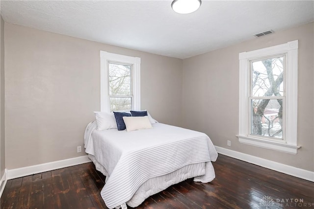 bedroom featuring dark hardwood / wood-style floors