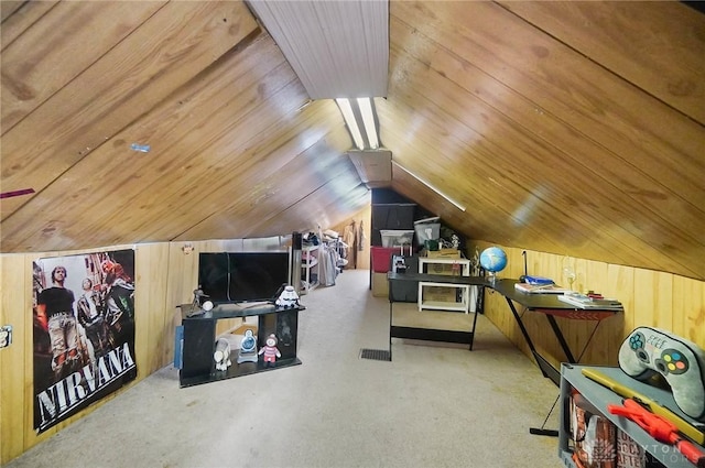 bonus room with vaulted ceiling, wood ceiling, and wooden walls