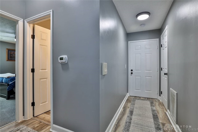 hallway featuring light hardwood / wood-style flooring