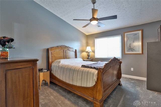 bedroom featuring ceiling fan, lofted ceiling, dark carpet, and a textured ceiling