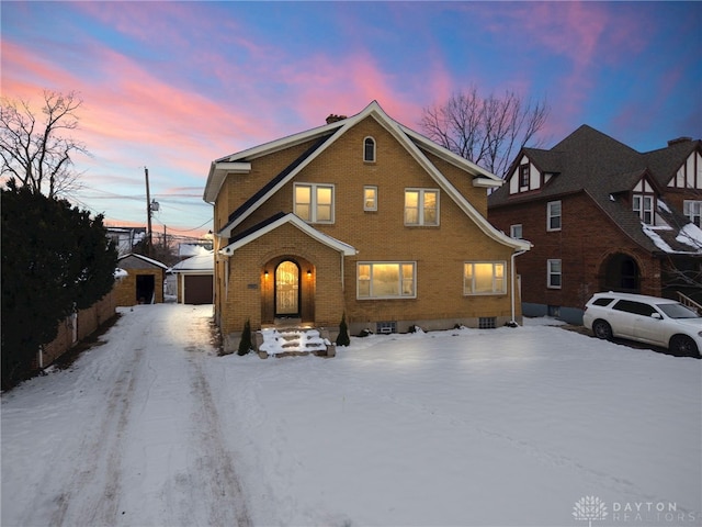 front of property with an outdoor structure and a garage