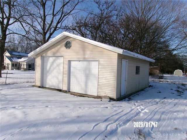 view of snow covered garage