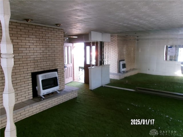 unfurnished living room with heating unit and a baseboard radiator