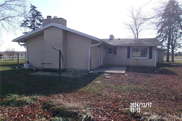 back of house with a patio