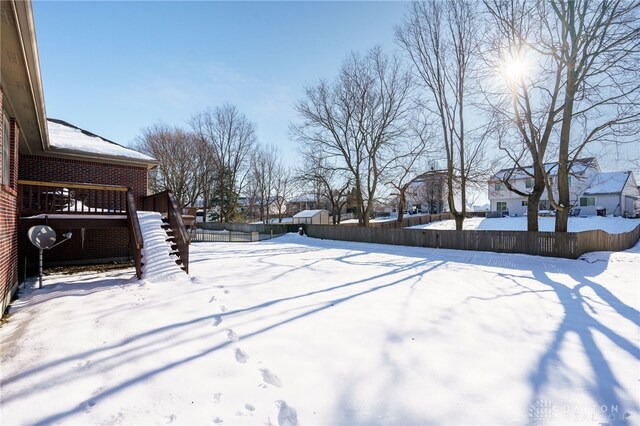 view of yard layered in snow