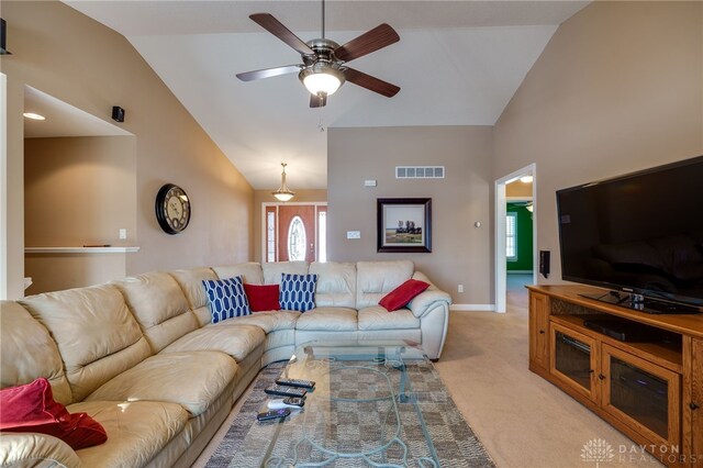 carpeted living room with lofted ceiling and ceiling fan