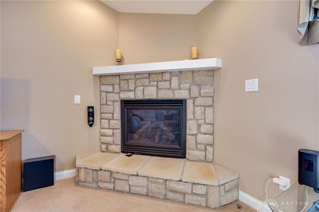 details with carpet floors and a stone fireplace