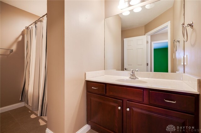 bathroom featuring vanity and tile patterned flooring