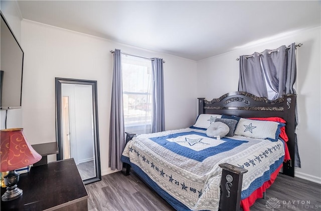 bedroom featuring dark hardwood / wood-style flooring