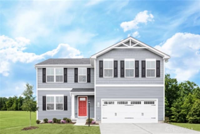 view of front of house featuring a front lawn and a garage