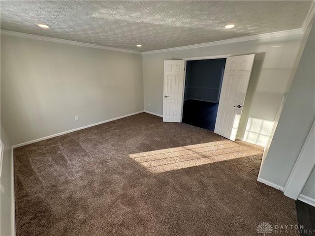 unfurnished bedroom featuring a textured ceiling, dark carpet, baseboards, and crown molding