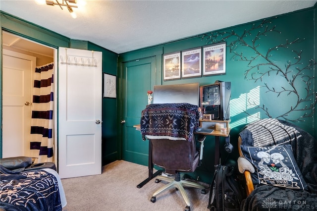 office area with carpet flooring and a textured ceiling