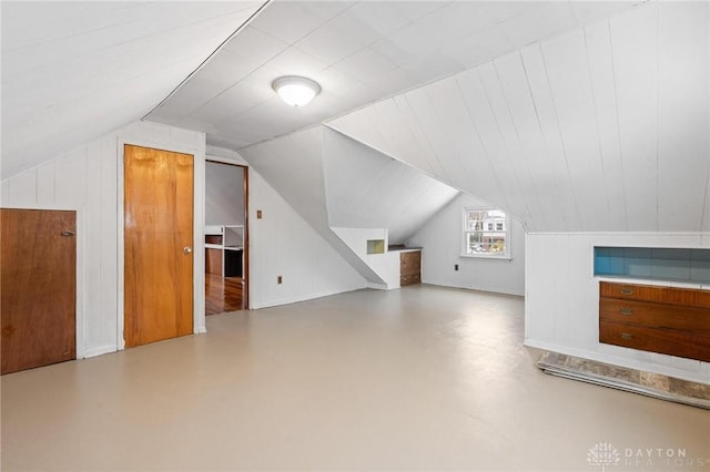 bonus room featuring vaulted ceiling