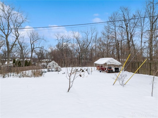 view of yard layered in snow