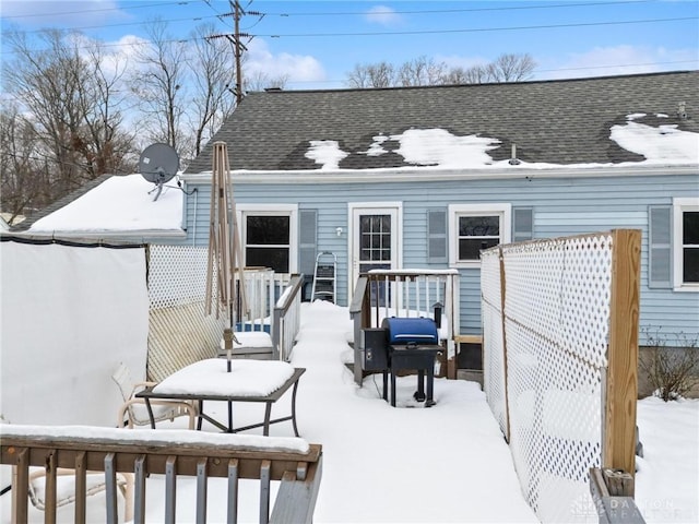 view of snow covered deck