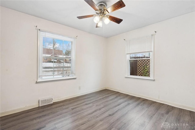 unfurnished room with ceiling fan and hardwood / wood-style floors