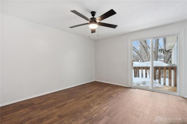 empty room featuring ceiling fan and hardwood / wood-style floors