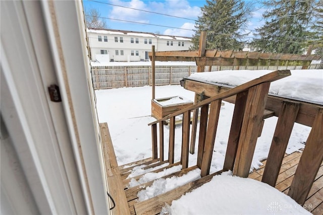 view of snow covered deck