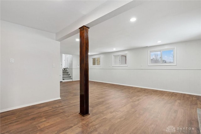 basement with dark hardwood / wood-style flooring