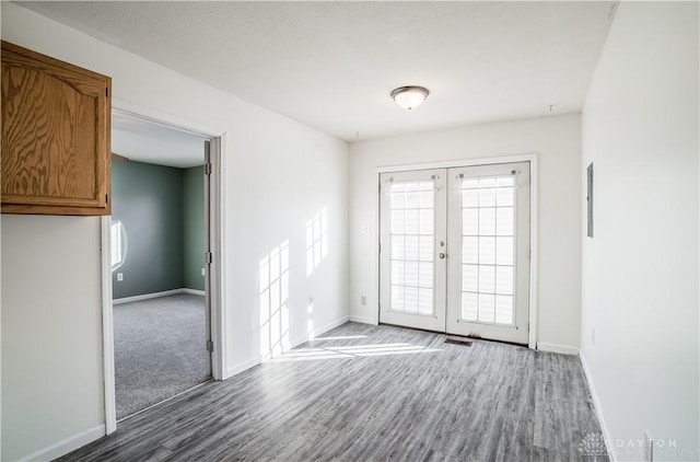 unfurnished room with french doors and hardwood / wood-style flooring