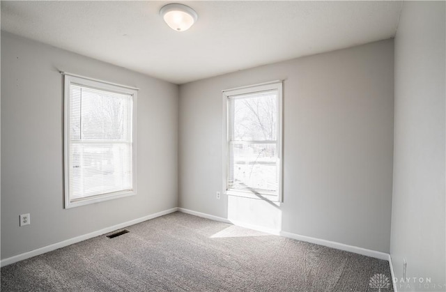 empty room with carpet flooring