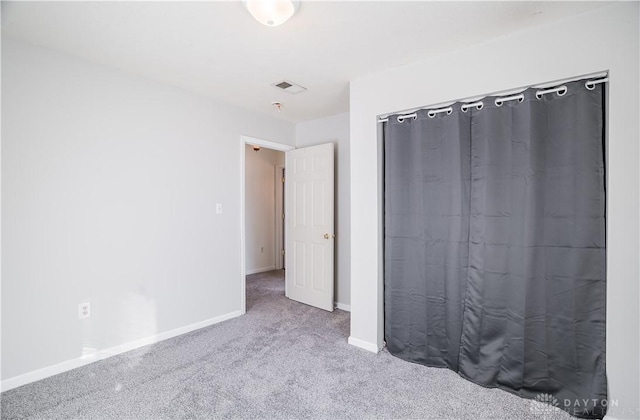 unfurnished bedroom with carpet flooring