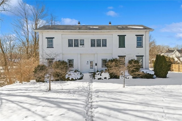 view of snow covered house