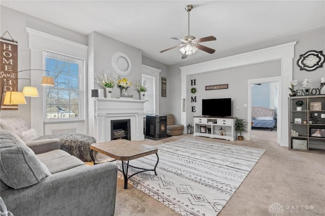 living room with ceiling fan and light colored carpet