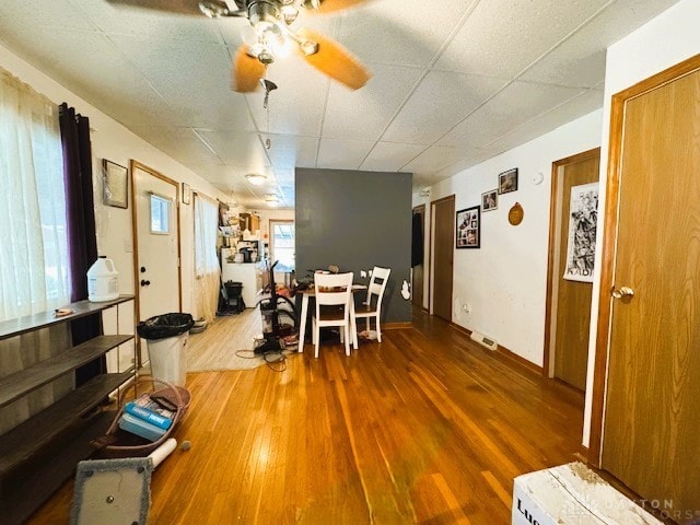 dining room featuring ceiling fan and hardwood / wood-style flooring