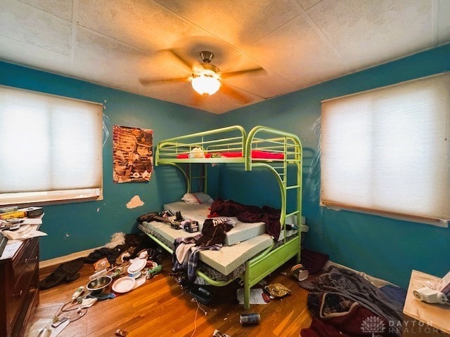 bedroom featuring ceiling fan and wood-type flooring